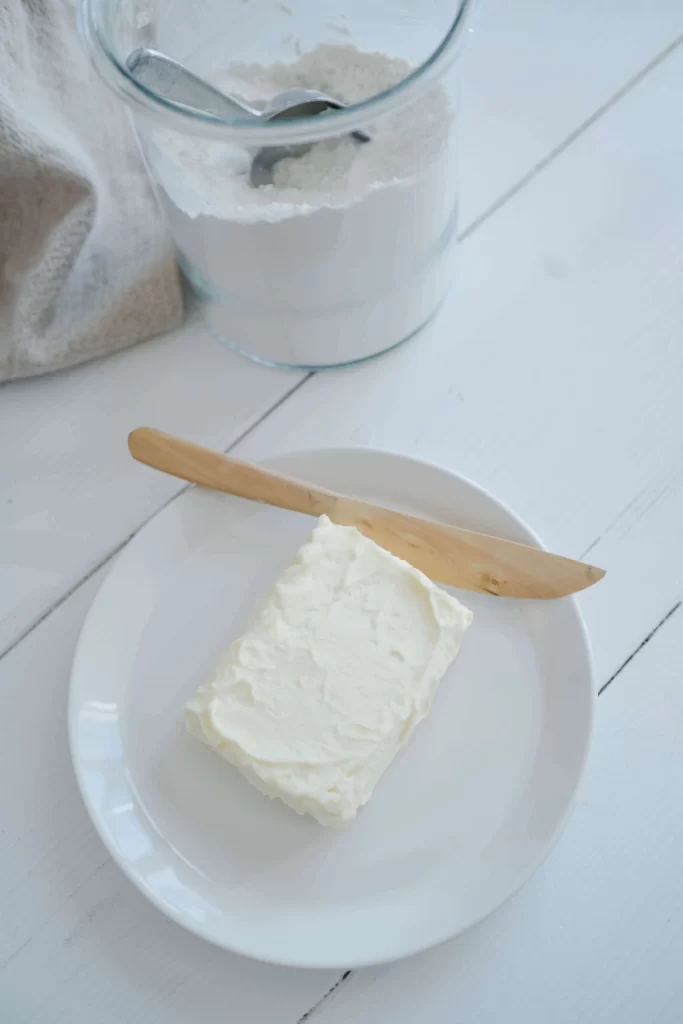 Butter and Butter Knife on White Plate