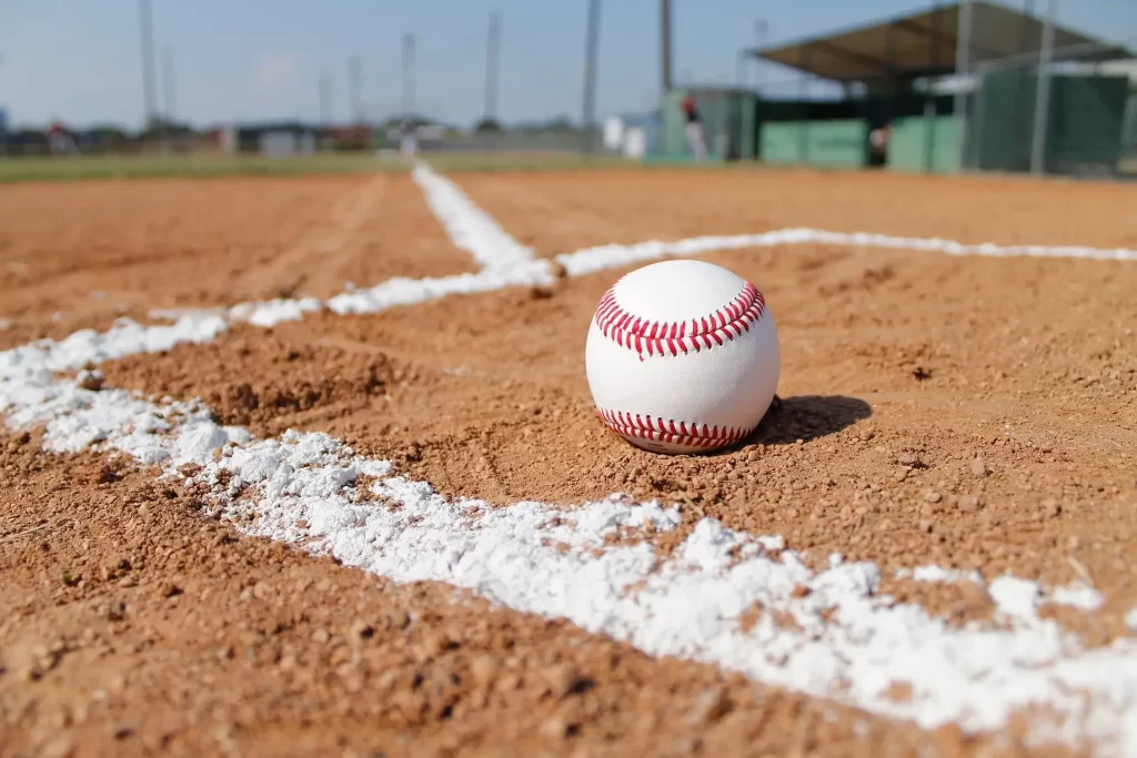 White Baseball Ball on Baseball Pitch
