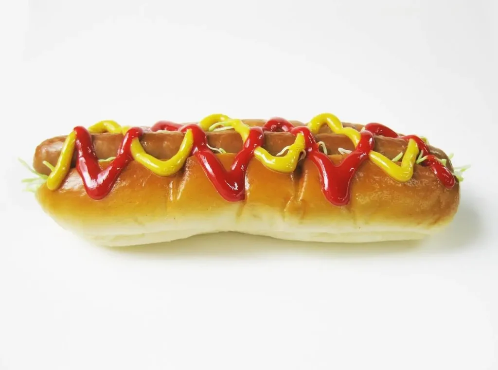 Hot Dog with Red and Yellow Sauce