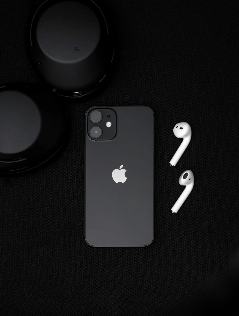 iPhone 12 Black Model with two airpods